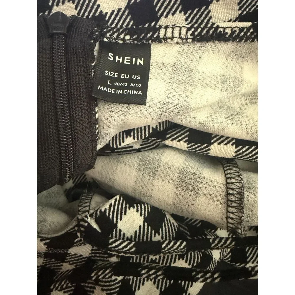Shein black and white gingham ruffle romper. Size large